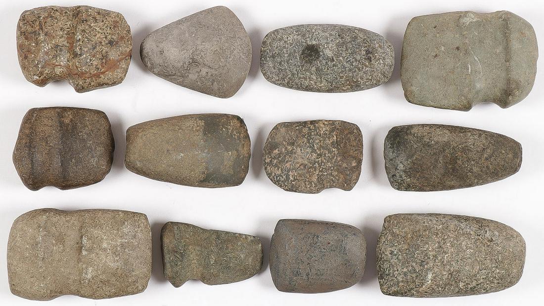 12 PREHISTORIC STONE TOOLS: 12 PREHISTORIC STONE TOOLS. Comprising six celts, and six axe heads in various states of condition. Greatest length 4.5 inches. SHIPPING NOTICE: Jackson's is your sole and only source for one stop pac