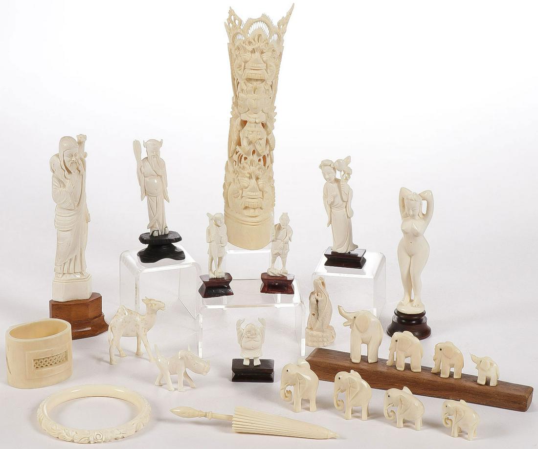 VINTAGE CARVED BONE GROUP: VINTAGE CARVED GROUP. Comprising 20 individually carved pieces, circa 1890-1950 including a carved figure of Christ as the good shepherd, elephants, a dragon netsuke, a bracelet, a Stanhop carved umbr
