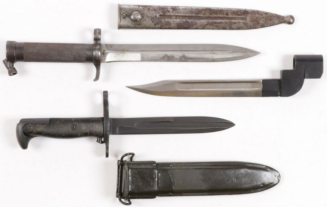 VINTAGE BAYONET GROUP: VINTAGE BAYONET GROUP. Comprising a Swedish bayonet (top row), a British No. 9 socket bayonet, dated 1949, and a US Korean War era cut down M1 Garande bayonet. Greatest length 13.75 inches. SHIPPING N
