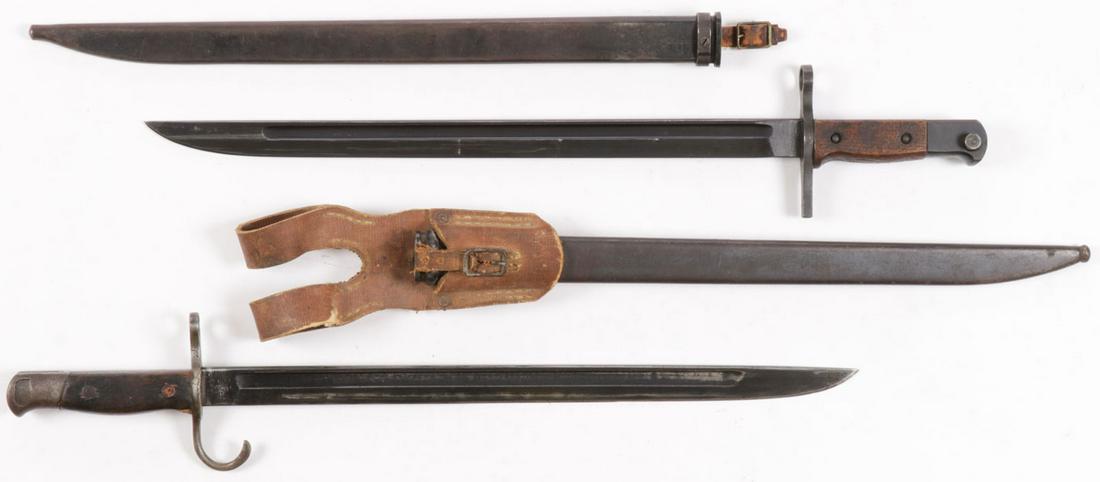 JAPANESE WWII BAYONETS: JAPANESE WWII BAYONETS. The top example probably unissued, certainly unused, maker's mark of Matsushita Metalworking Corp., the bottom example a Type 30 with original canvas frog, maker's mark of Koku