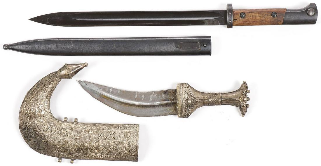 BAYONET AND JAMBIYA: BAYONET AND JAMBIYA. Comprising a K98 bayonet with wood grips, unissued, unused condition. Together with a traditional jambiya, as shown. SHIPPING NOTICE: Jackson's is your sole and only source for o