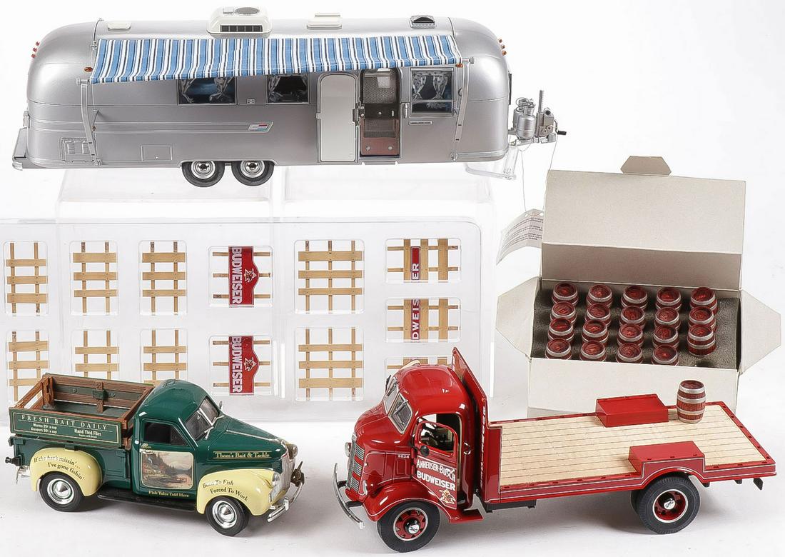 A GREAT GROUP OF COLLECTORS TOYS: A GREAT GROUP OF COLLECTORS TOYS. Comprising three collectors toys including a 1938 Budweiser delivery truck appearing complete in original box, a Franklin Mint 1968 airstream trailer, and an Ertl 194