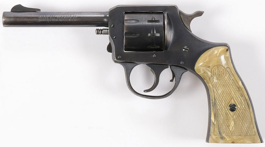 PAIR OF PISTOLS: PAIR OF PISTOLS. Comprising an H&R model 922 .22 cal. revolver, 9 shot with plastic grips. SN N26638. Together with a Raven Model P-25 nickel plated semi-automatic .25 cal pistol with wood grips. SN 4