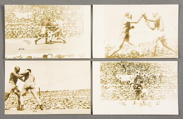 BLACK MEMORABILIA: BOXING REAL PHOTO POSTCARDS: FOUR JACK JOHNSON BOXING REAL PHOTO POSTCARDS circa 1910. All ring-side action scenes of the Johnson Jeffries fight, three by photographer Dana and two with Bull Durham advertising banner in backgroun