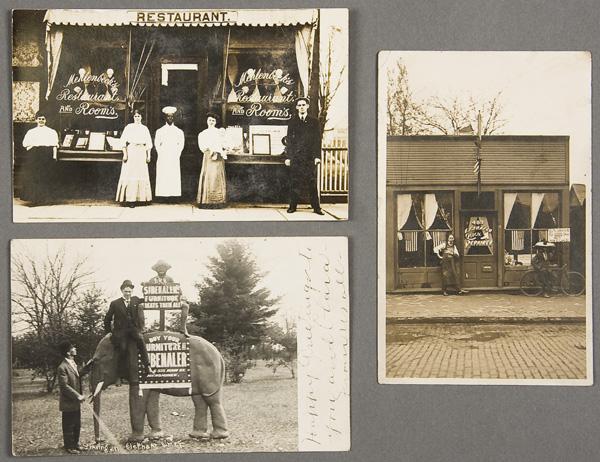 BLACK MEMORABILIA: ADVERTISING POSTCARD: FOUR ADVERTISING REAL PHOTO POSTCARDS early 20th century. For Flannigan coal, a restaurant with black chef, a furniture dealer with stuffed elephant and black boy sign holder, and shoe repairman with 