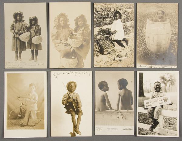 BLACK MEMORABILIA: REAL PHOTO POSTCARD: EIGHT BLACK CHILDREN REAL PHOTO POSTCARDS early 20th century. Including girls with baskets, boy with bike and other scenes. One postally used. Good to excellent condition.