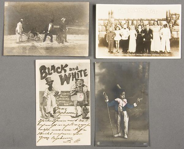 BLACK MEMORABILIA: ENTERTAINMENT POSTCARD: FOUR BLACK ENTERTAINER POSTCARDS early 20th century. Consisting of a real photo "Midget Swing Review", a black man with bear in wheelbarrow real photo, together with a commercial photo cake walk scene