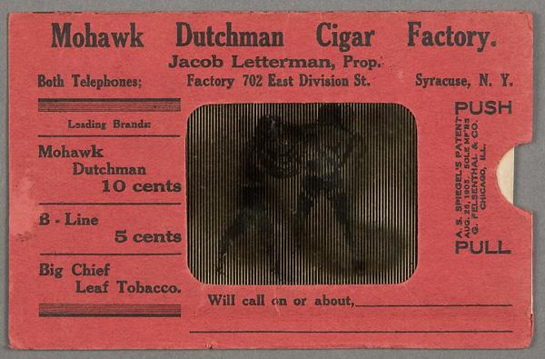 BLACK MEMORABILIA: ADVERTISING POSTCARD: A MOHAWK DUTCHMEN CIGAR FACTORY MOVING PICTURE POSTCARD early 20th century with black and white boxers (probably Johnson and Jeffries). Postally unused. Good working condition.