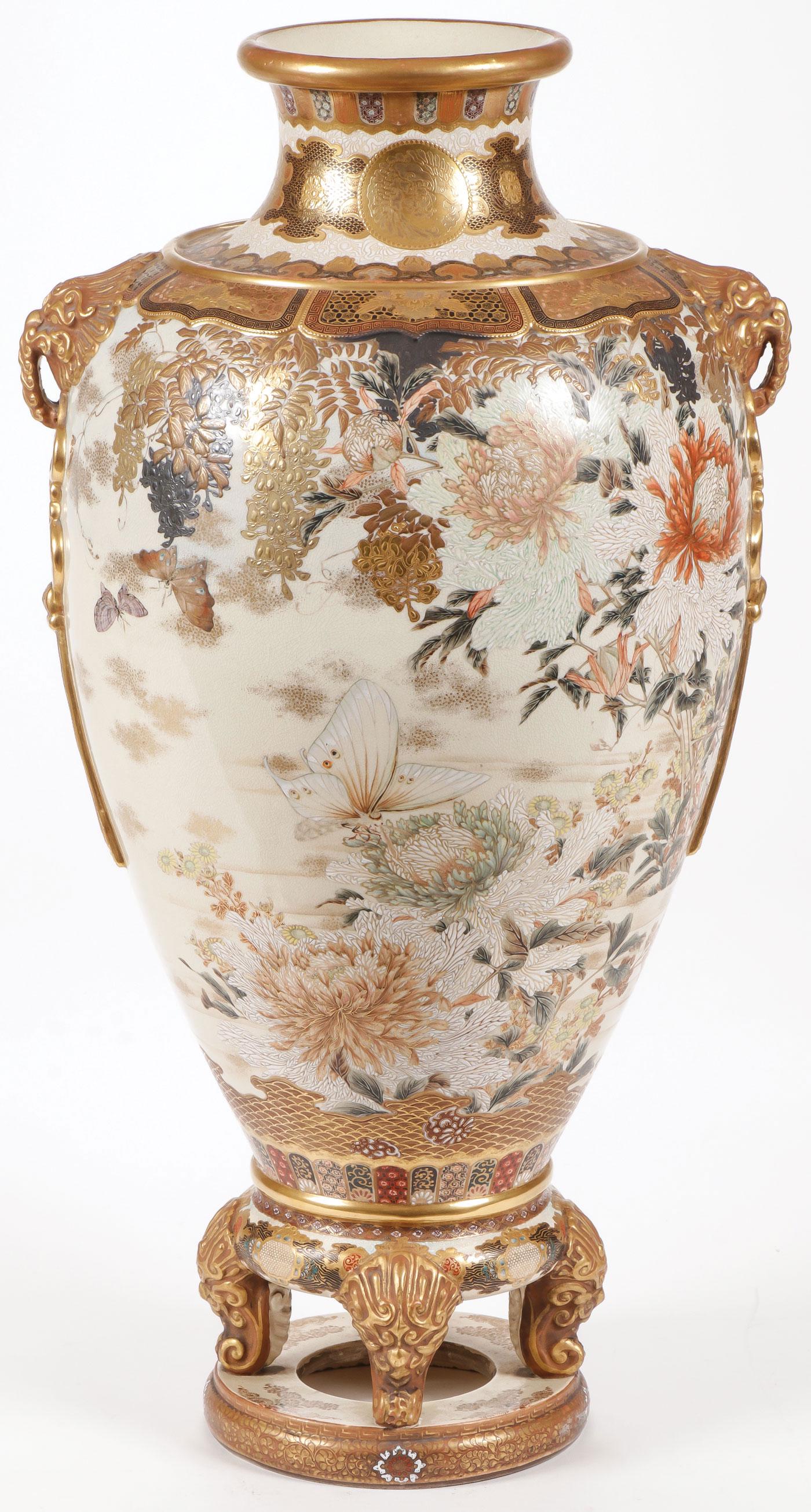 STUNNING SATSUMA VASE, MEIJI: STUNNING SATSUMA VASE, MEIJI. Comprising a large and impressive heavily decorated satsuma vase resting on four scrolled feet atop an integral ring base, the sides finely decorated with mums, butterfli