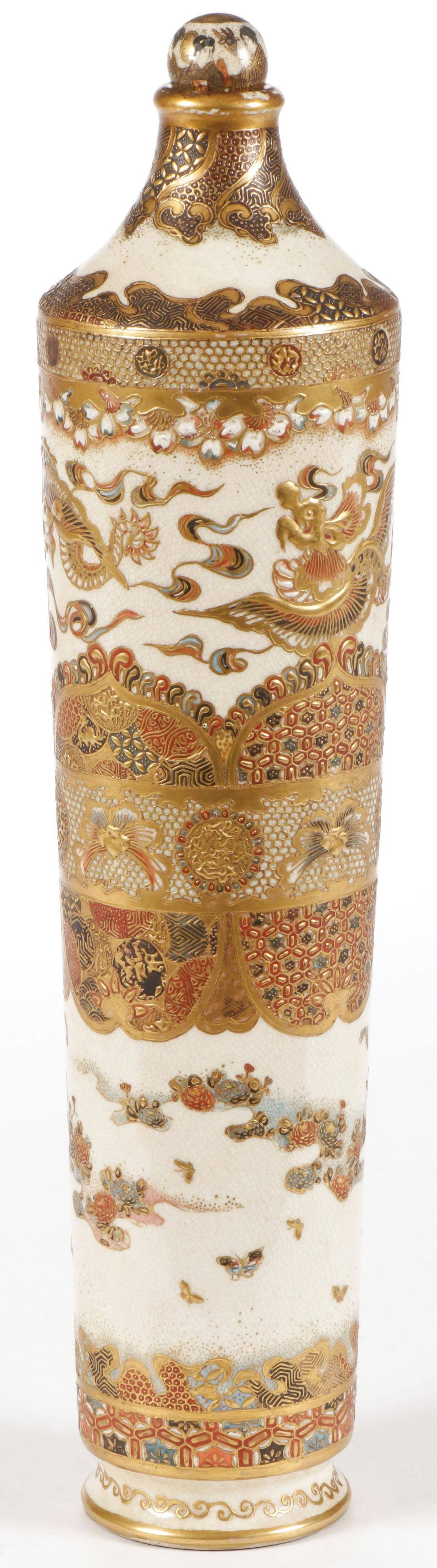 AN INTERESTING SATSUMA VASE, MEIJI: AN INTERESTING SATSUMA VASE, MEIJI. Of tapering cylindrical form, the sides profusely decorated in gilt flower forms, dragons and repeating patterns, and with ball stopper. Signed on underside of base