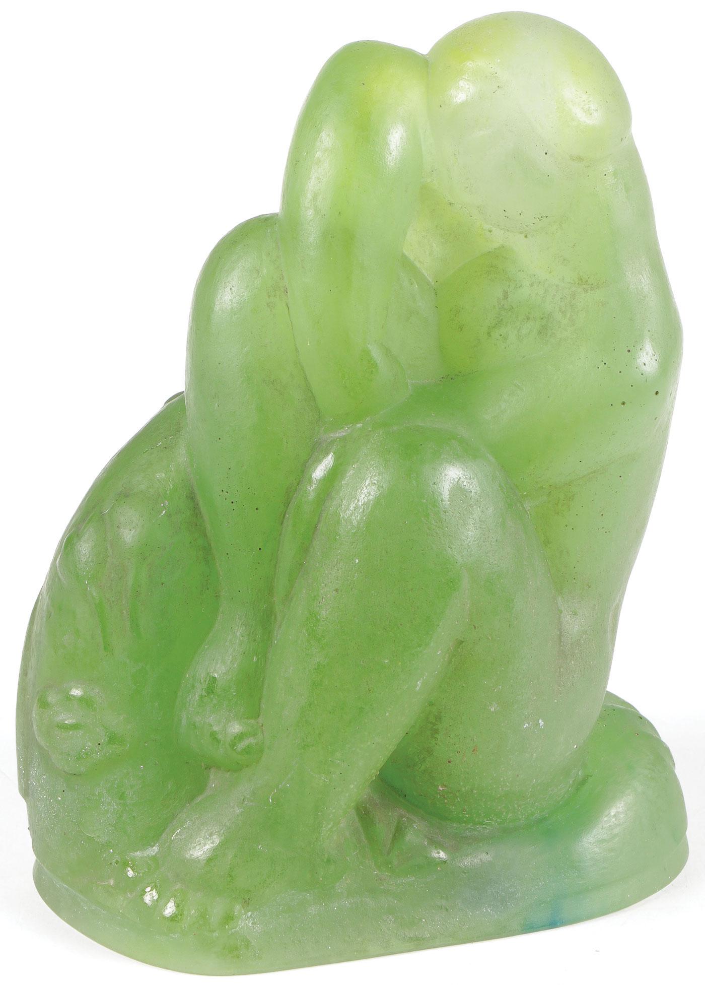 ART DECO PATE DE VERRE NUDE C. 1925: ART DECO PATE DE VERRE NUDE C. 1925. Sculpted in full round in green glass, a seated nude female figure amidst flowers, probably by Almaric Walter, although unsigned. Height 6.5 inches (16.5 cm), widt