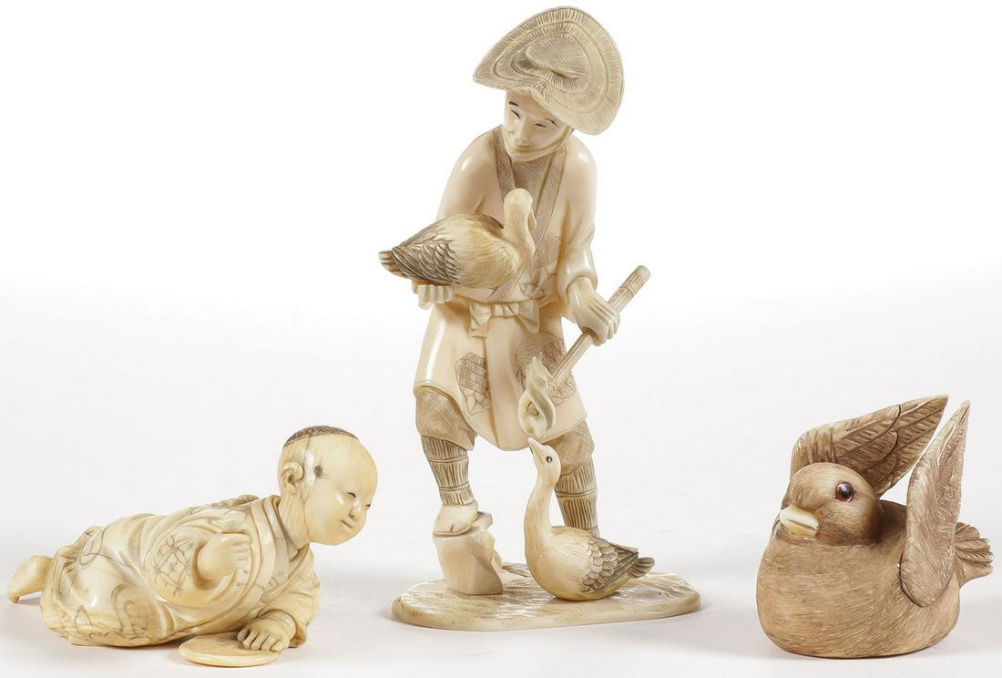 THREE JAPANESE CARVED OKIMONO, MEIJI: THREE JAPANESE CARVED OKIMONO, MEIJI. Comprising a finely carved infant crawling along the floor, carved in full round of excellent proportions and exact anatomy. Together with a standing figure of a 