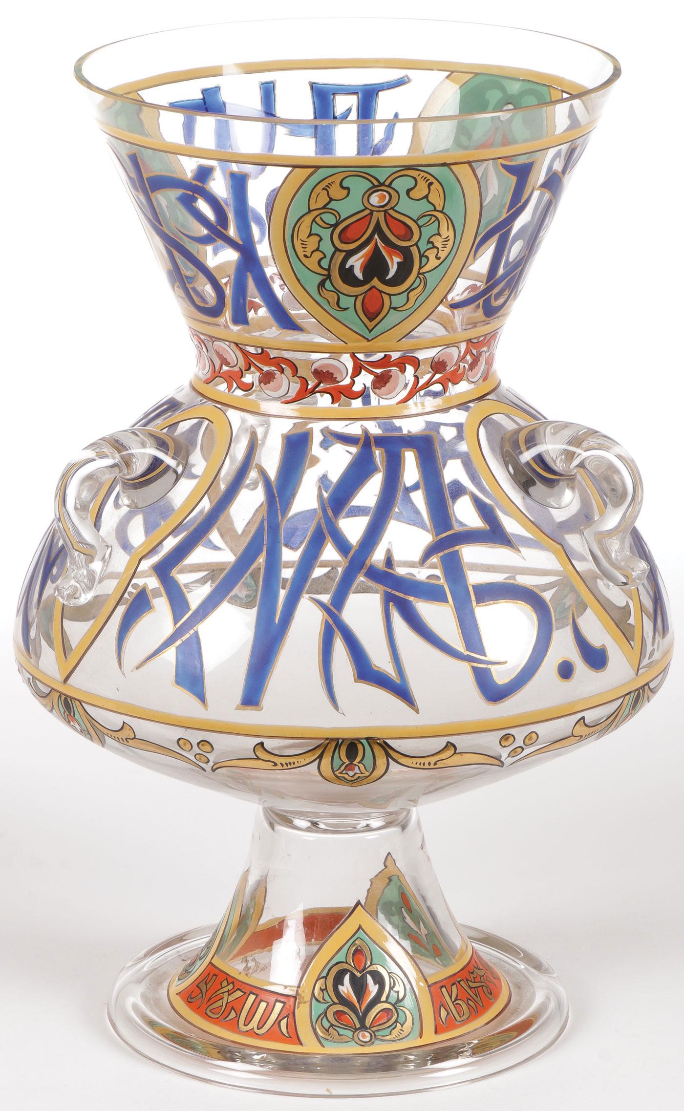 ENAMELED GLASS MOSQUE LAMP FRITZ HECKERT C. 1880: ENAMELED GLASS MOSQUE LAMP FRITZ HECKERT C. 1880. With spread base and suspension lugs on shoulder, the body overall enameled in the Islamic style, with polished ground pontil, attributed to Fritz Hec