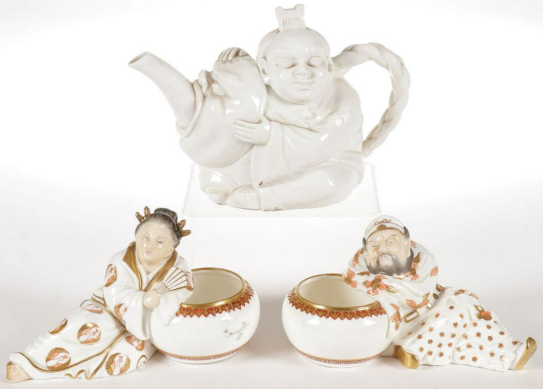 ENGLISH MINTON ASIAN PORCELAIN: ENGLISH MINTON ASIAN PORCELAIN. Comprising a Minton Chinaman figural teapot, impressed on underside of base, and a pair of Minton reclining Chinese figures resting on large bowls, and finely decorated