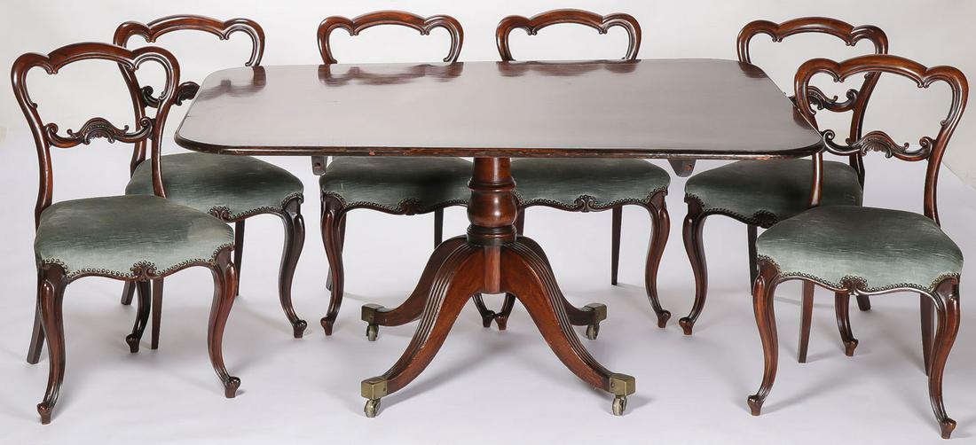 TILT TOP TABLE DINING ROOM SET: TILT TOP TABLE DINING ROOM SET. Comprising a tilt top table with rectangular form top set on a turned pedestal giving way to Queen Anne legs set on casters. Together with six matching chairs set with