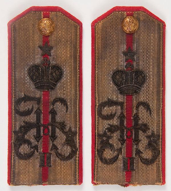 PAIR IMPERIAL RUSSIAN OFFICER SHOULDER BOARDS: A PAIR OF IMPERIAL RUSSIAN OFFICERS (LIEUTENANT) SHOULDER BOARDS, 65TH INFANTRY MOSKOVSKII HIS HIGHNESS REGIMENT. Bullion embroidery on a red wool field with the cipher of Nicholas II beneath the Impe