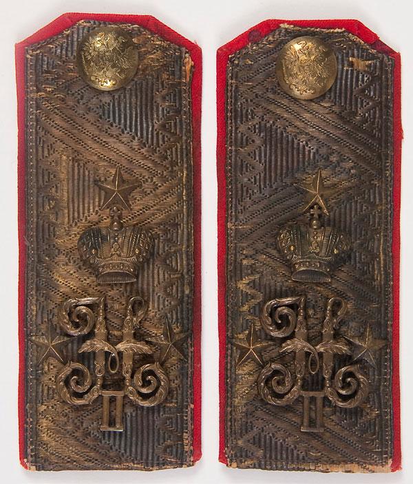 PAIR IMPERIAL RUSSIAN OFFICER SHOULDER BOARDS: A PAIR OF IMPERIAL RUSSIAN GENERAL OFFICERS SHOULDER BOARDS, circa 1900. Bullion zigzag border on a red wool field and set with the cipher of Nicholas II beneath the Imperial crown. 6.25 inches x 2.5 