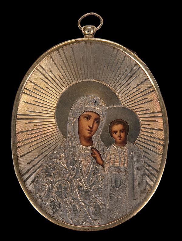 RUSSIAN PERSONAL PENDANT ICON KAZAN MOTHER OF GOD: A RUSSIAN PERSONAL PENDANT ICON OF THE KAZAN MOTHER OF GOD, CIRCA 1860. The engraved silver-gilt riza and frame with integral suspension loop Hallmarked Moscow, dated 1860, indistinguishable makers ma