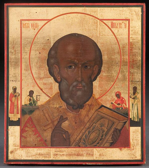 RUSSIAN ICON: ST. NICHOLAS: A RUSSIAN ICON OF ST. NICHOLAS, 19TH CENTURY. The borders with St. Peter Metropolitan and St. Gregory. 10.5 inches x 9.25 inches (26.75 x 23.75 cm).
