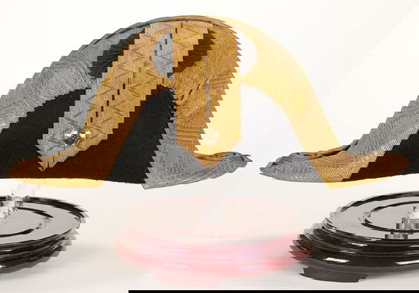 AUSTRIAN GENERAL UNIFORM: AN AUSTRIAN GENERAL'S DRESS CHAPEAU, circa 1900. Black felt trimmed in broad gold bullion braid with a black silk cockade and gold General's pattern button. Corners of the hat display black and gold b