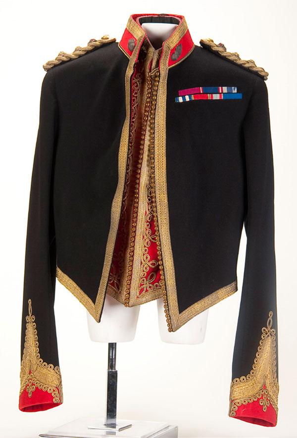 BRITISH ROYAL ARTILLERY MILITIA COLONEL'S UNIFORM: A BRITISH ROYAL ARTILLERY MILITIA COLONEL'S MESS DRESS JACKET AND VEST, ca. 1920. Dark blue wool jacket with red collar and cuffs richly trimmed in gold bullion with flaming bomb collar insignia, a do