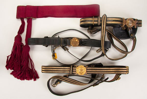 BRITISH OFFICER'S DRESS SWORD BELT AND SASH: A BRITISH OFFICER'S DRESS SWORD BELT AND SASH LOT, ca. 1910. Comprising a black leather belt and hanger straps with gold bullion trim. Together with a naval dress belt of gold bullion and black silk o
