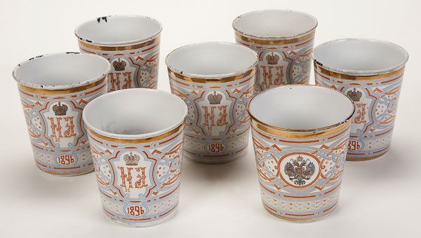 7 RUSSIAN CORONATION CUPS: A GROUP OF SEVEN NICHOLAS II ENAMEL CORONATION CUPS, 1896. Each displaying the conjoined cipher of Nicholas II and Alexandra Feodorovna beneath the Imperial crown and above the date 1896. The sides ba