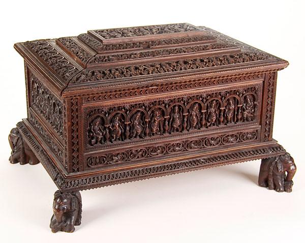 ASIAN CARVED WOOD CASKET: A VERY FINE SINO-TIBETAN CARVED SANDALWOOD CASKET 19th century. Deeply carved with 70 Buddhist deities in heavy relief and fine detail. Each within a recessed portico surrounded by foliates and patter