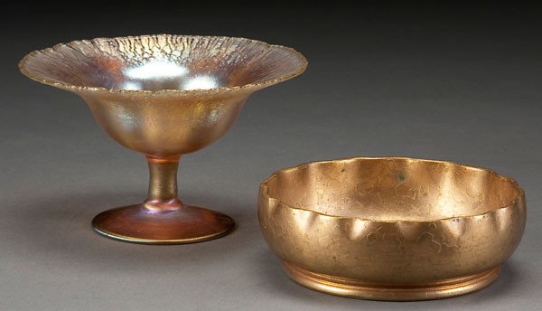 PAIR TIFFANY STUDIOS GLASS ITEMS: A PAIR OF TIFFANY STUDIOS ITEMS early 20th century. Comprising a gold Favrile glass compote with iridized stretch finish and an etched gilt bronze low bowl #1719. Signed "L.C.T. Favrile" and "Tiffany 
