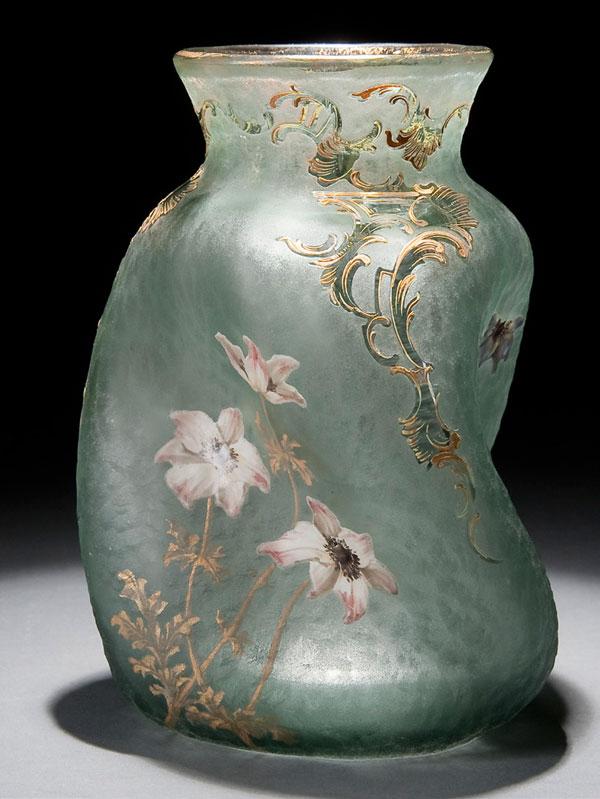 MONT JOYE CAMEO GLASS VASE: A FINE MONT JOYE ENAMELED CAMEO GLASS VASE circa 1900. Of pinched and swirled form in teal colored glass cut and finely enameled with purple florals heightened in gilt. Unsigned. Height 7.75 inches (1