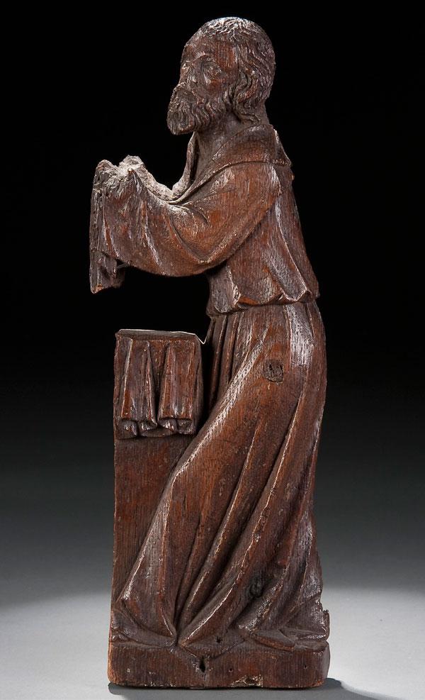 RELIGIOUS SCULPTURE, SIMON: A NORTHERN FRENCH CARVED OAK FIGURE OF THE PROPHET SIMEON, AROUND 1500. Carved in three quarters round with good proportions and deep folds, from a Presentation in the Temple grouping. Ht. 13.25 inche