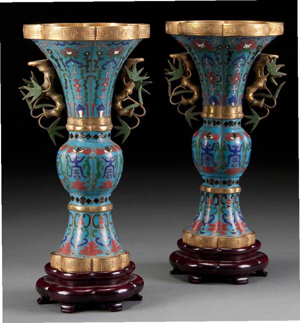 PAIR ORIENTAL BRONZE & ENAMEL BEAKER VASES: A PAIR OF CHINESE GILT BRONZE CLOISONNE HANDLED BEAKER VASES 20th century. With figural bamboo handles below lobed gilt bronze rims. Finely enameled with Buddhist designs. Height 11.25 inches (28.5 cm