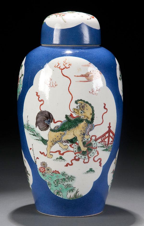 ORIENTAL PORCELAIN JAR WITH LID: A FINE CHINESE QING DYNASTY PORCELAIN JAR WITH DOME LID. The sides with large reserves decorated with playful lions and worsted balls. Unmarked. Ht 11.5 inches (29cm).
