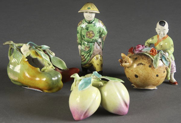 4 CHINESE DECORATED PORCELAIN FIGURAL NOVELTIES: A GROUP OF 4 CHINESE DECORATED PORCELAIN FIGURAL NOVELTIES late 19th/early 20th century. Consisting of a figural seed pod water dropper, a figural pepper brush washer, a cluster of peaches and a boy f