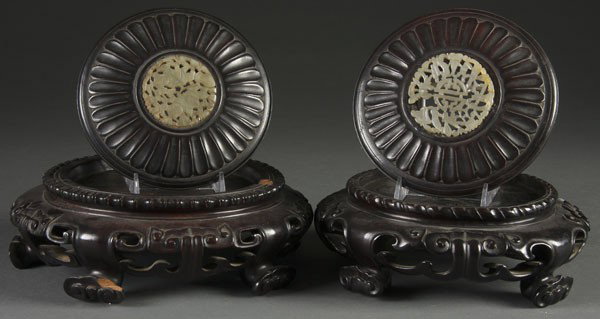 PR CHINESE CARVED WOOD URN STANDS & LIDS: A PAIR OF CHINESE CARVED WOOD URN STANDS & LIDS 19th century with carved jade inserts. Diameter 8 inches.