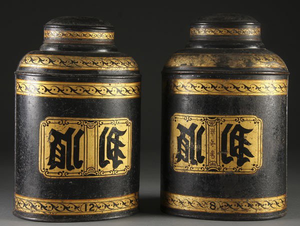 PAIR OF JAPANNED TIN TEA CONTAINERS: A PAIR OF JAPANNED TIN TEA CONTAINERS 19th century. With gilt decoration on black ground. Height 18 inches.
