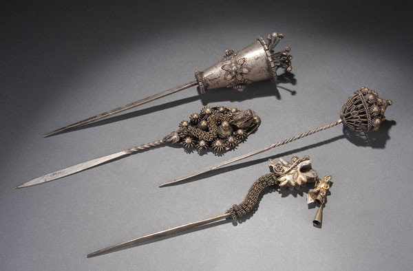 4 CHINESE MIAO MINORITY SILVERED HAIRPINS: FOUR VERY FINE CHINESE MIAO MINORITY SILVERED HAIRPINS 19th/early 20th century. Comprising two coilwork figural dragons, a basket and a cone-shape vase with coiled rosettes and extending buds. Length 