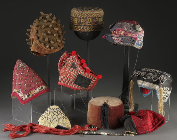 6 CHINESE & TIBETAN SKULL CAPS: A COLLECTION OF 6 CHINESE & TIBETAN SKULL CAPS early to mid 20th century. Of woven and pieced construction with embroidered decoration. Together with an African woven headdress, 2 Turkish fezes (one w