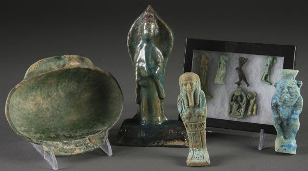 10 PC ANCIENT STYLE ARTIFACT GROUPING: A 10-PIECE ANCIENT STYLE ARTIFACT GROUPING consisting of an early glazed press molded deity, a glazed handled water coupe and Egyptian glazed ushabti and effigies. The largest 6 inches.