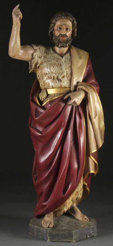 CARVED WOOD FIGURE OF ST. JOHN THE BAPTIST: A CARVED & POLYCHROME WOOD FIGURE OF ST. JOHN THE BAPTIST 19th century, probably German. Carved in full round with good proportions, deep folds and flowing hair. Losses to left hand. Height 42.75 inch