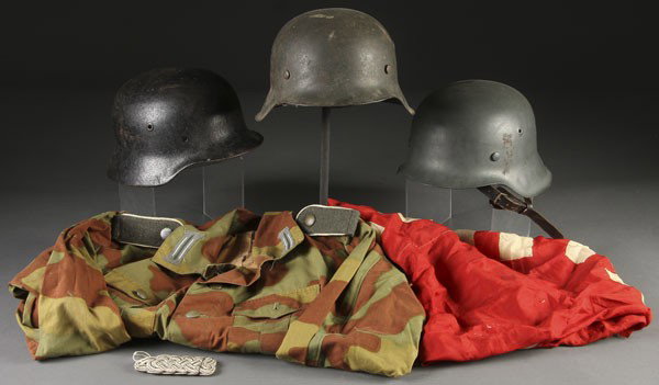 WWII AXIS GEAR: A GROUP OF WWII AXIS GEAR including 2 German M42 helmets, one being a Norwegian re-issue, the other with partial pigskin liner. And a relic condition M40 shell. Together with a pair of original SS Stu