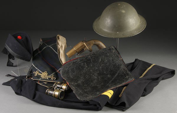 GROUP OF BRITISH MILITARIA: A GROUP OF MISC. MOSTLY BRITISH MILITARIA circa 1850-1940, including pants, vest, helmet, brass flare/signal gun, and a pair of binoculars.