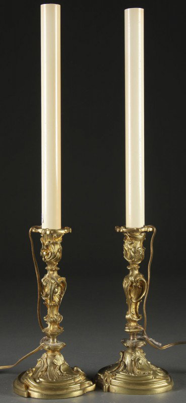 FRENCH LOUIS XV GILT BRONZE CANDLE STANDS, 19TH C: A PAIR OF FRENCH LOUIS XV STYLE GILT BRONZE CANDLE STANDS 19th century, with electrified candles. Overall height 24.5 inches.
