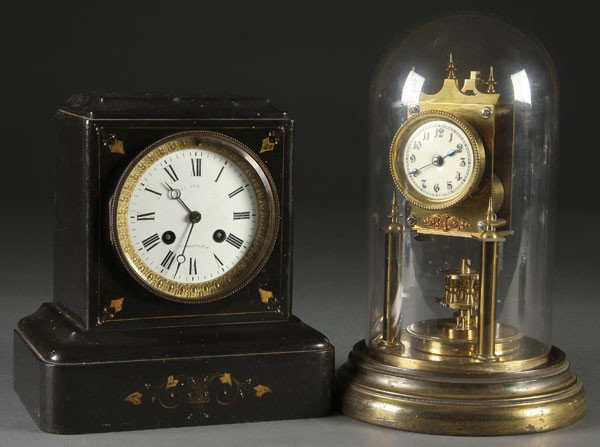 VICTORIAN BLACK CASED MANTLE CLOCK: A VICTORIAN BLACK CASED MANTLE CLOCK together with an early gilt bronze Gustav Becker anniversary clock under a crystal dome. Tallest 12 inches.