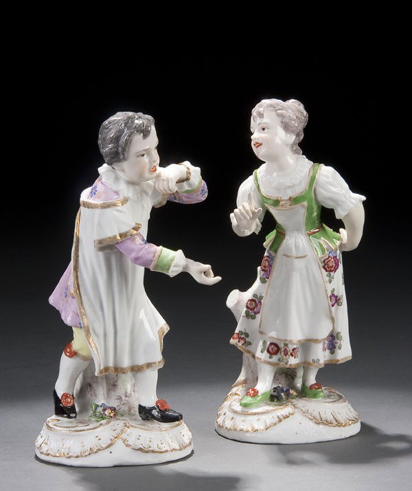 PR. MEISSESN STYLE FIGURES OF A BOY & GIRL: A PAIR OF MEISSEN STYLE FIGURES OF A BOY & GIRL 19th century, spurious blue underglaze crossed sword marks. Height 7 inches.