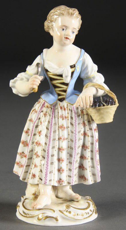 MEISSEN PORCELAIN FIGURE: A FINE MEISSEN PORCELAIN FIGURE early 20th century. Of a girl with basket. Blue crossed pommel sword marks. Height 5.5 inches.