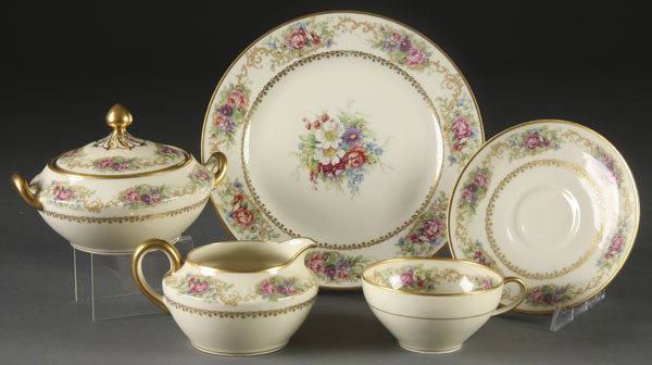 26 PC SET OF CERAMIC ART DINNERWARE: A 26-PIECE SET OF CERAMIC ART FOR MARSHALL FIELD DINNERWARE Tuvire de France pattern, first half 20th century. With floral and gilt decoration. Service for 8, comprising eight 8.75-inch plates, eight 