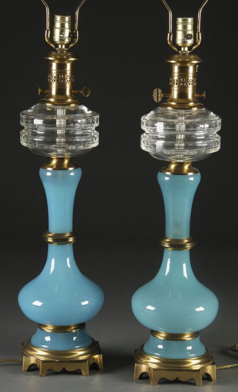 FRENCH CUT CRYSTAL & OPALINE MOUNTED TABLE LAMPS: A VERY FINE PAIR OF FRENCH CUT CRYSTAL AND OPALINE GILT BRONZE MOUNTED TABLE LAMPS mid 20th century. Of oil lamp form, the harps stamped Automax Ny 11418. Height as illustrated 29 inches.