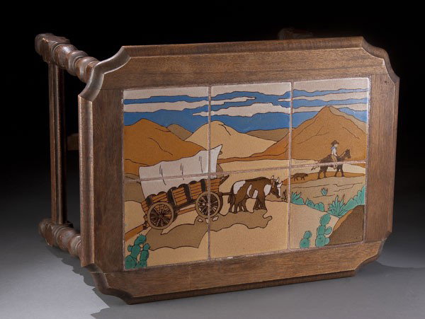 TAYLOR ART POTTERY TILE COCKTAIL TABLE: A TAYLOR ART POTTERY TILE COCKTAIL TABLE, first half 20th century, with glazed scene of a covered wagon within a wooden legged table, repaired chip. Length 24 inches, width 17.5 inches, height 16.5 in