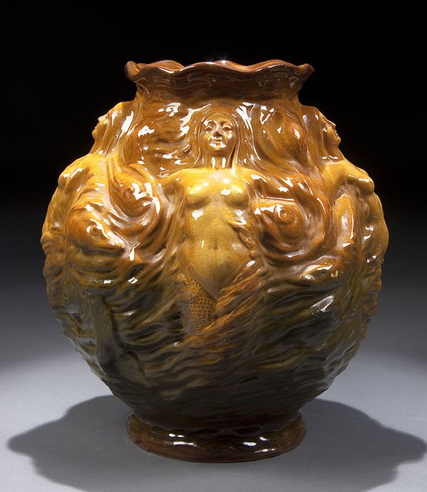 VANCE FAIENCE ART NOUVEAU POTTERY VASE: A VANCE FAIENCE ART NOUVEAU POTTERY VASE, early 20th century, with embossed design of mermaids and fish, marked on base Vance F.Co and No. 118, some minor restorations. Height 12.5 inches.